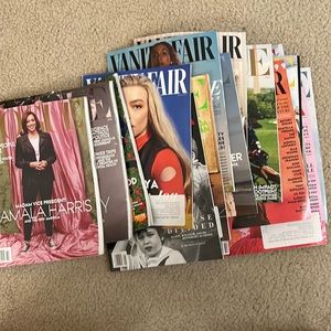 A bunch of Vogue and Vanity fair magazines